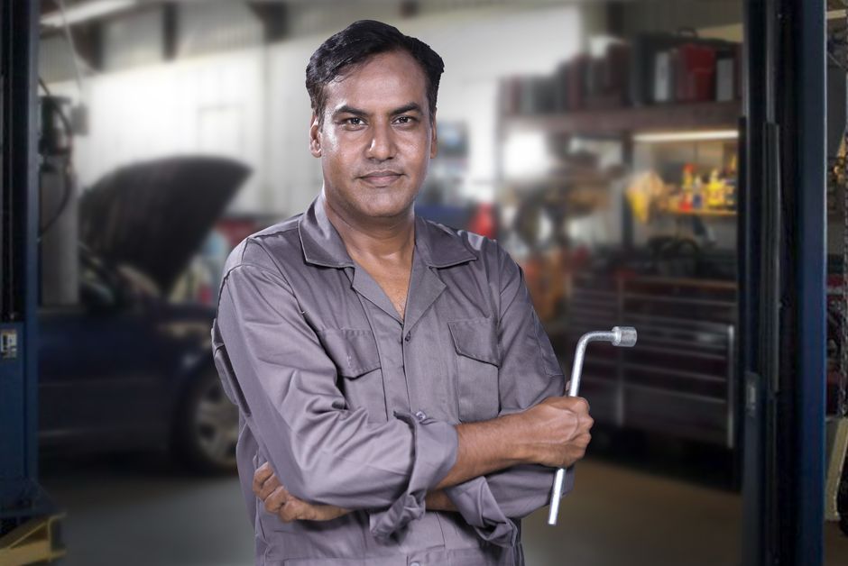 Auto glass technician evaluating a windshield